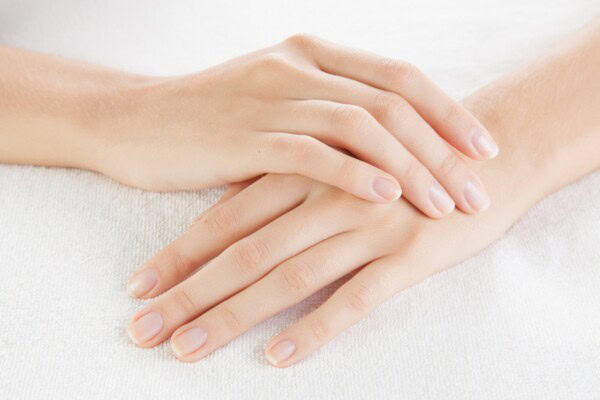 beautiful woman hands are on a towel
